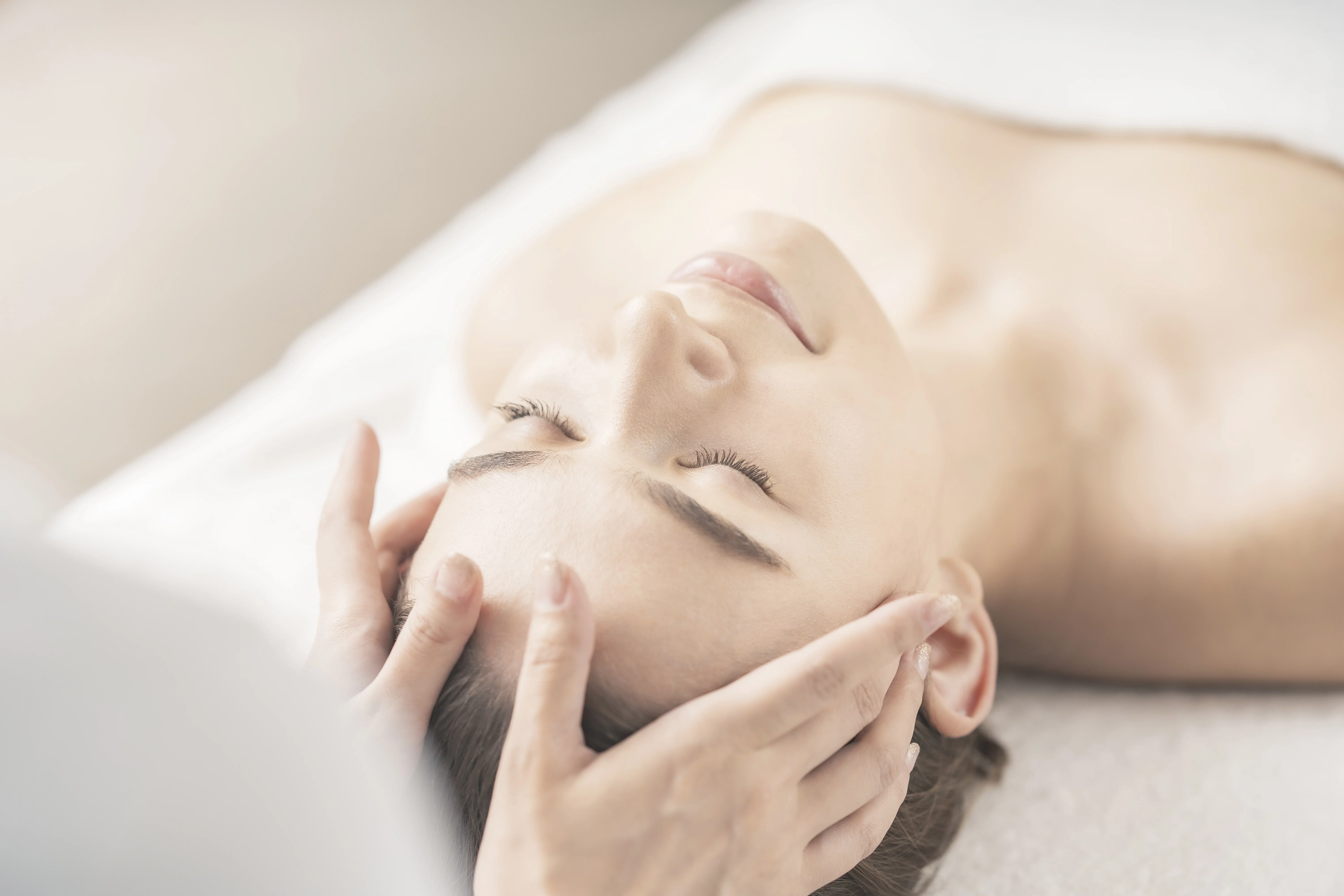 Young Woman Having Her Head Massaged Beauty Salon